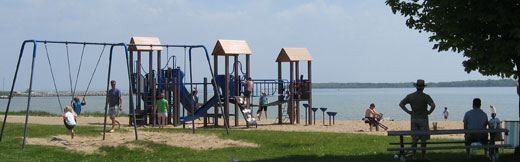 A playground on the beach with children playing